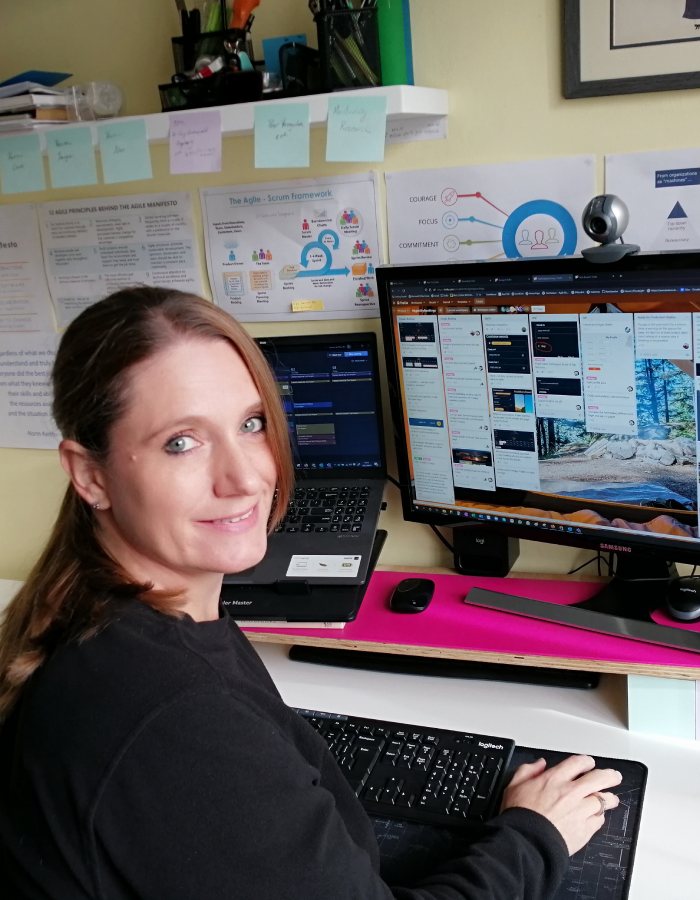 KRS scrum master smiling at her desk